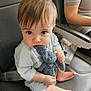baby, child, stuffed_toy, elephant_toy, seat, leather_seat, person, hand, foot, curious, indoors, casual_clothing, cute, young_child, candid, chewing, toy, infant, closeup, portrait