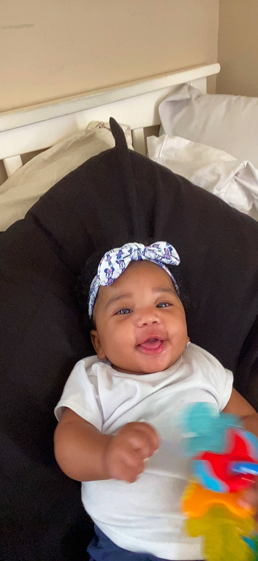Avayah is registered to the contest to win money with this photo: baby, baby_products, baby_toddler_clothing, cap, cheek, child, comfort, eye, fashion_accessory, fun, happy, hat, headband, headgear, headwear, linens, person, sitting, smile, textile