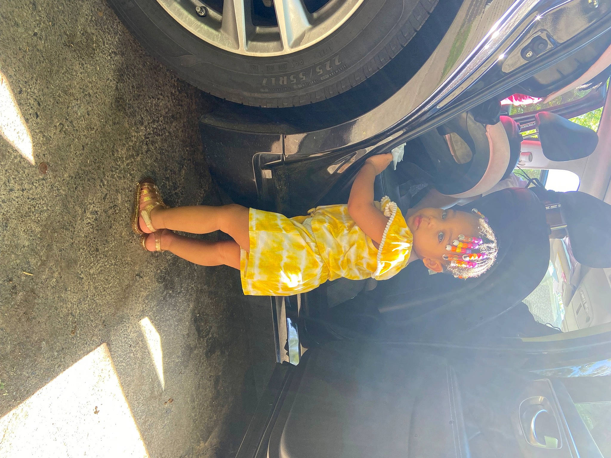 Azalea is registered to the contest to win money with this photo: alloy_wheel, asphalt, automotive_design, automotive_exterior, automotive_lighting, automotive_tire, automotive_wheel_system, bumper, car, fender, hood, hubcap, motor_vehicle, person, rim, tire, tread, trunk, vehicle, vehicle_door