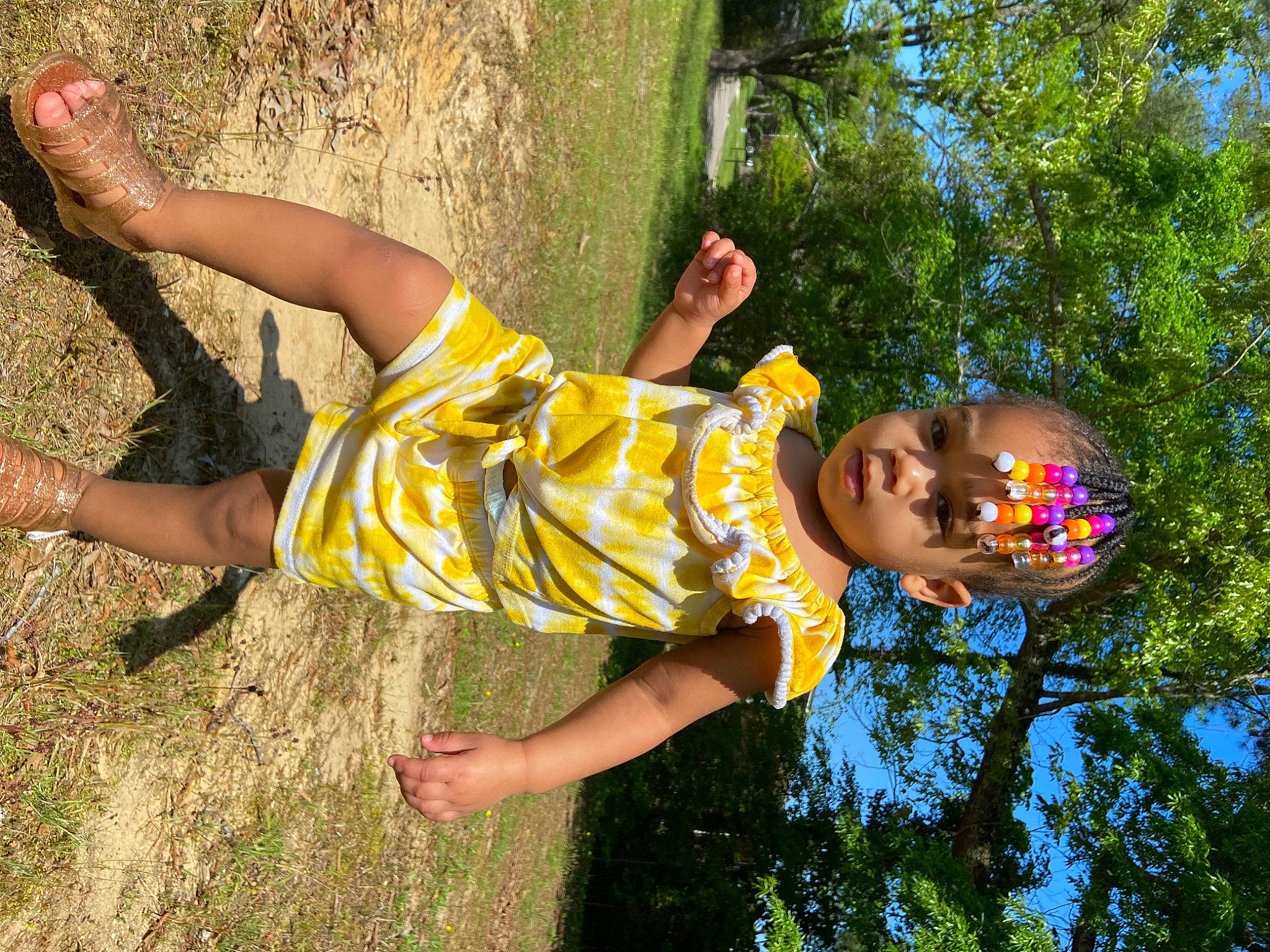 Azalea is registered to the contest to win money with this photo: arm, barefoot, child, fun, grass, happy, human_leg, knee, leisure, people_in_nature, person, plant, play, recreation, shorts, summer, sunlight, thigh, toddler, tree
