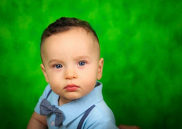 Leonel is registered to the contest to win money with this photo: baby, cheek, child, chin, close_up, eye, face, forehead, grass, green, happy, head, lip, nose, person, photography, plant, portrait, skin, smile