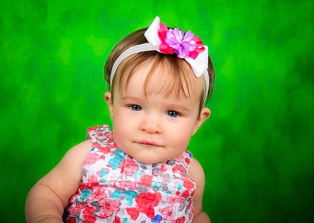 Lexie is registered to the contest to win money with this photo: baby, child, child_model, dress, ear, fashion_accessory, flower, grass, hair_accessory, headband, headgear, headpiece, person, petal, photography, pink, plant, skin, toddler