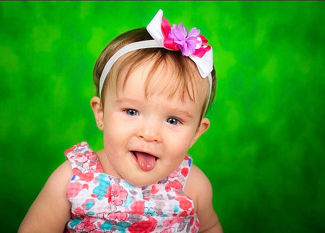 Lexie is registered to the contest to win money with this photo: baby, beauty, cheek, child, child_model, dress, fashion_accessory, fun, grass, hair_accessory, happy, head, headband, headgear, headpiece, lip, person, pink, skin, smile