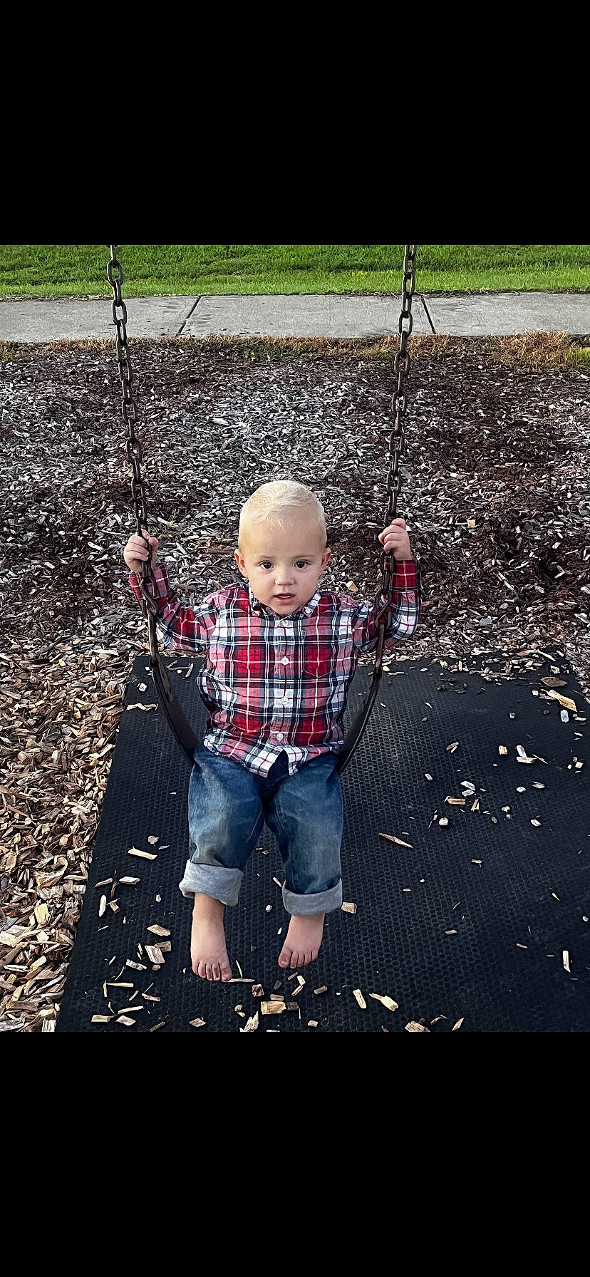 Brantlee joined the competition — help win amazing prizes! asphalt, baby, child, city, design, fun, grass, landscape, leisure, line, outdoor_play_equipment, people_in_nature, person, plaid, plant, playground, recreation, swing, tartan, toddler
