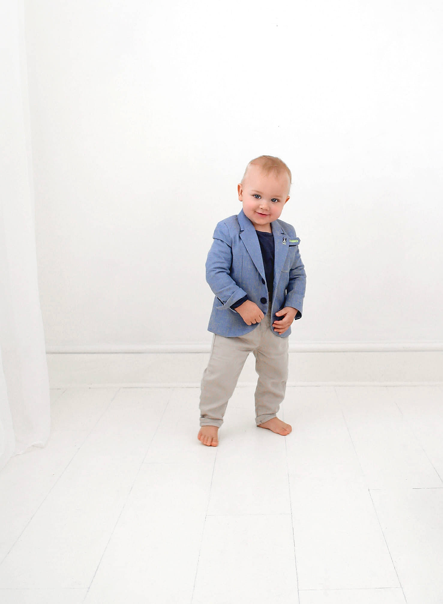 Bruno is registered to the contest to win money with this photo: child, denim, floor, flooring, joy, male, outerwear, person, photograph, photography, portrait, portrait_photography, shoe, shoulder, sitting, sleeve, snapshot, standing, stock_photography, toddler