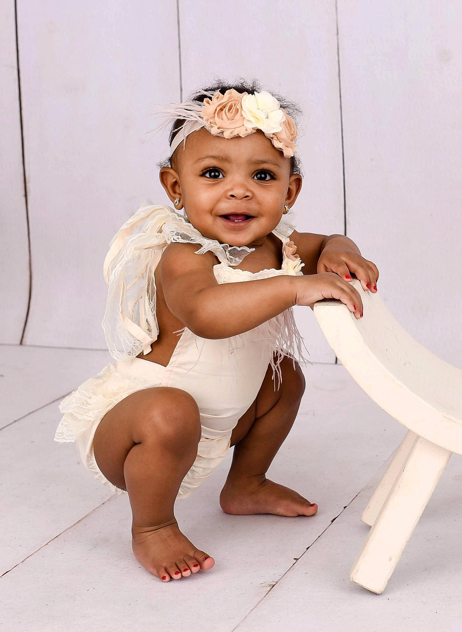 Nylah is registered to the contest to win money with this photo: baby, baby_toddler_clothing, barefoot, child, child_model, fashion_accessory, hair_accessory, headband, headpiece, headwear, joy, leg, person, photo_shoot, sitting, skin, smile, toddler