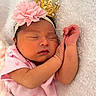 newborn, baby, sleeping, pink_outfit, headband, flower, crown, blanket, soft_texture, infant, cute, peaceful, portrait, closeup, child, adorable, resting, skin, hand, cozy