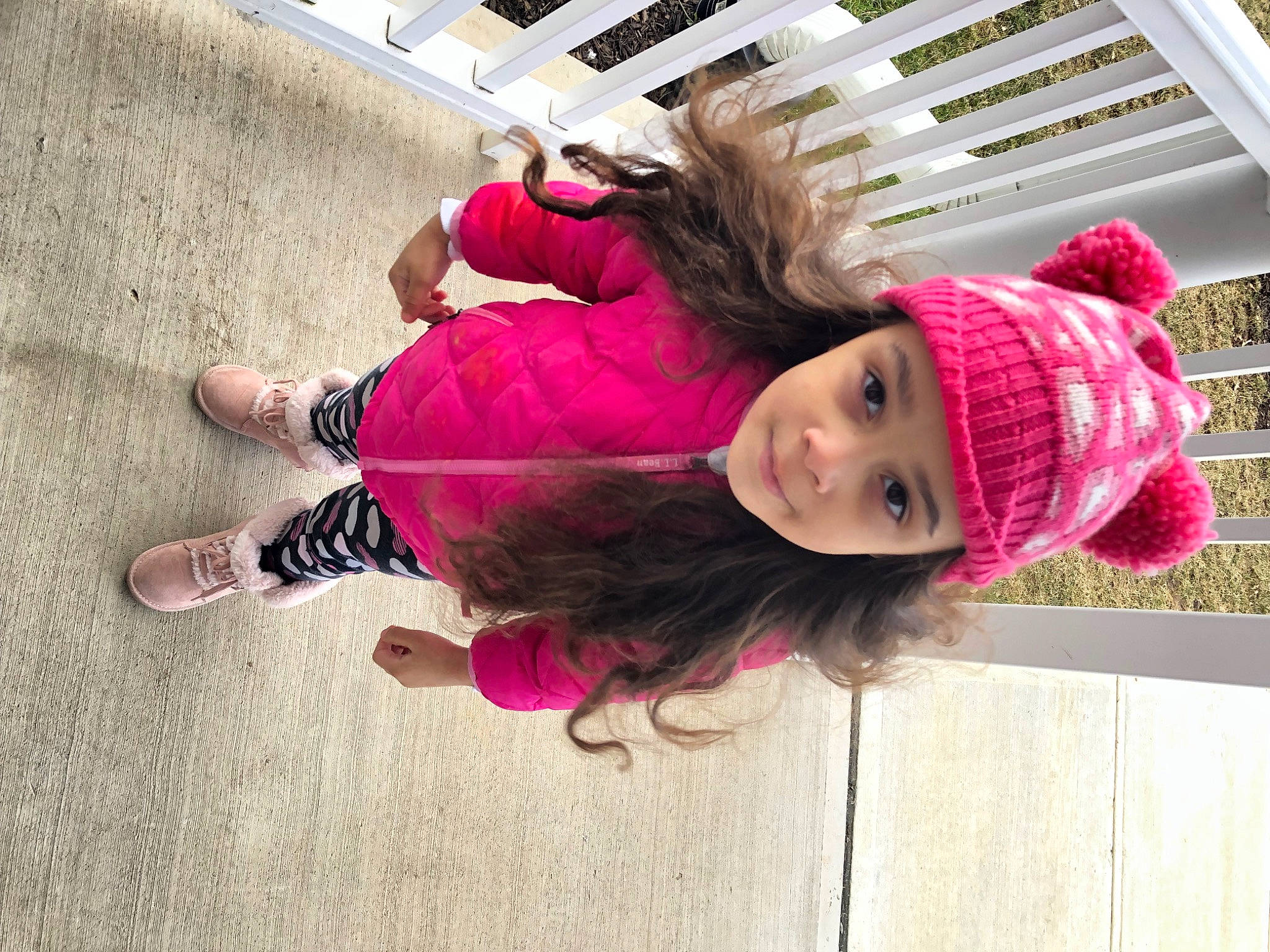 Charli is registered to the contest to win money with this photo: beanie, cap, child, flooring, foot, fun, headwear, human_leg, knit_cap, leisure, magenta, pattern, person, pink, purple, recreation, toddler, vacation, vertebrate, violet