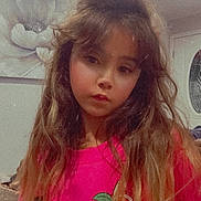 Harbor is registered to the contest to win money with this photo: child, girl, indoor, portrait, long_hair, pink_sweatshirt, cartoon_graphic, casual_clothing, serious_expression, painting, flower_art, home_interior, decorative_door, brown_hair, wavy_hair, young_person, fashion, person, closeup, lighting