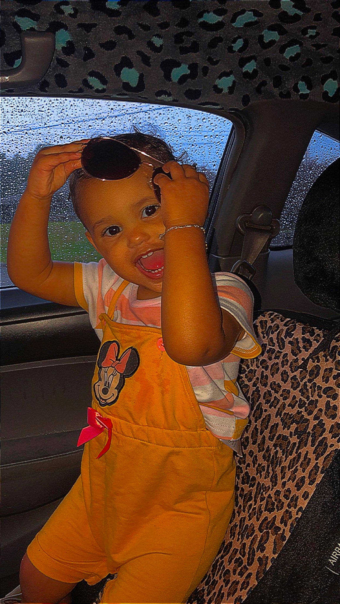 Aubrey is registered to the contest to win money with this photo: auto_part, automotive_design, automotive_exterior, car_seat, child, eyewear, finger, fun, gesture, glasses, hand, happy, luxury_vehicle, mouth, person, personal_protective_equipment, sunglasses, thumb, toddler, vehicle_door