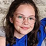 blue_hoodie, casual_clothing, child, eyewear, face, freckles, friendly, girl, glasses, happy, head_and_shoulders, human, indoors, light_skin, long_hair, natural_light, person, portrait, smile, young