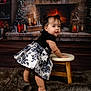animal, baby, canine, clothing, couch, dog, dress, face, fireplace, furniture, hardwood, head, indoors, person, pet, photography, portrait, sitting, skirt, wood