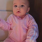 Shelby participe au concours pour gagner de l'argent avec cette photo : adidas, apparel, baby, child, clothing, comfortable, curious, cute, expression, face, fashion, head, indoor, person, pink_tracksuit, portrait, seated, sitting, soft_lighting, young