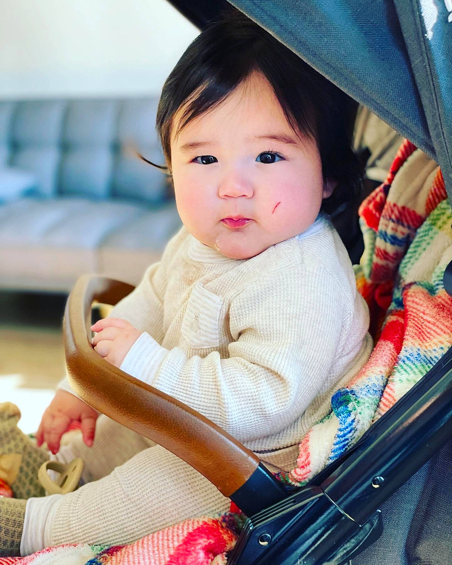 Wesley is registered to the contest to win money with this photo: baby, baby_carriage, baby_products, baby_toddler_clothing, beauty, cap, cheek, child, chin, comfort, fashion_accessory, happy, hat, person, product, sitting, skin, sleeve, snapshot, sock