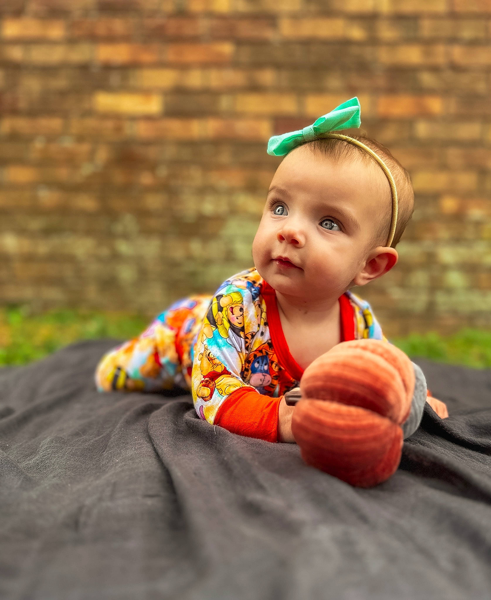 November joined the competition — help win amazing prizes! arm, baby, baby_toddler_clothing, ball, child, dress, eye, fruit, fun, grass, happy, head, orange, people_in_nature, person, plant, pumpkin, sitting, toddler, tree