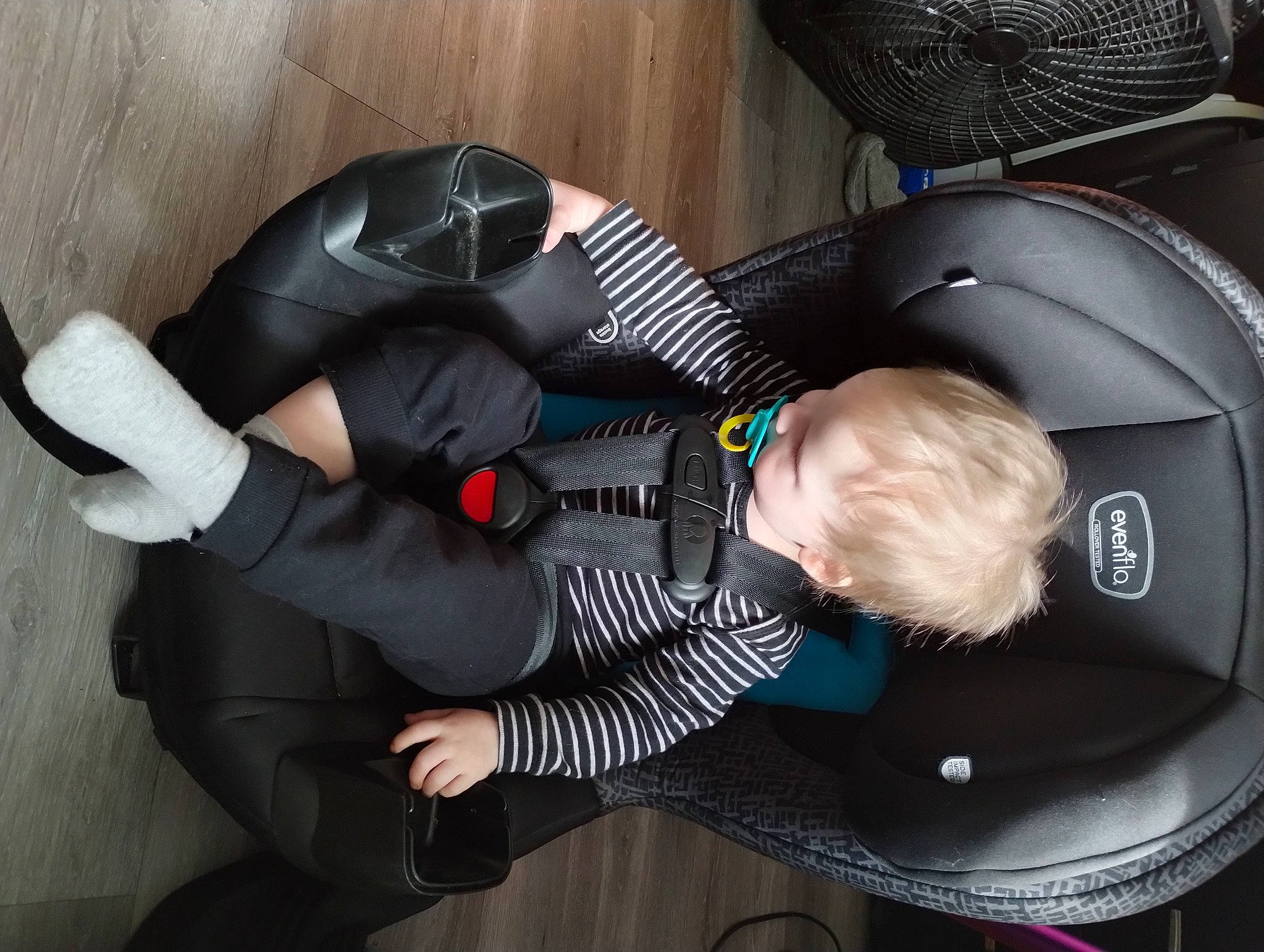 Kaleb is registered to the contest to win money with this photo: auto_part, baby, baby_carriage, baby_products, baby_safety, baby_toddler_clothing, car_seat, child, comfort, fun, hat, lap, luxury_vehicle, person, personal_protective_equipment, sitting, suit, toddler