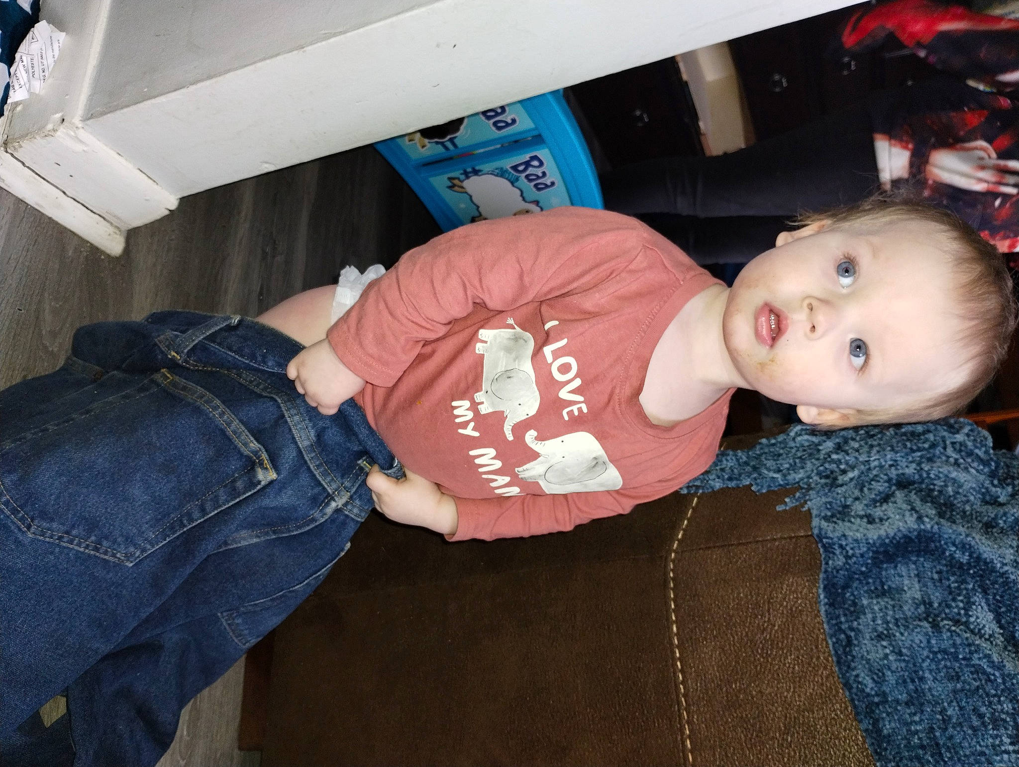 Kaleb is registered to the contest to win money with this photo: automotive_exterior, baby, baby_products, baby_toddler_clothing, comfort, denim, elbow, electric_blue, fun, hat, human_leg, jeans, knee, person, sitting, sleeve, surprise, t_shirt, thigh, toddler