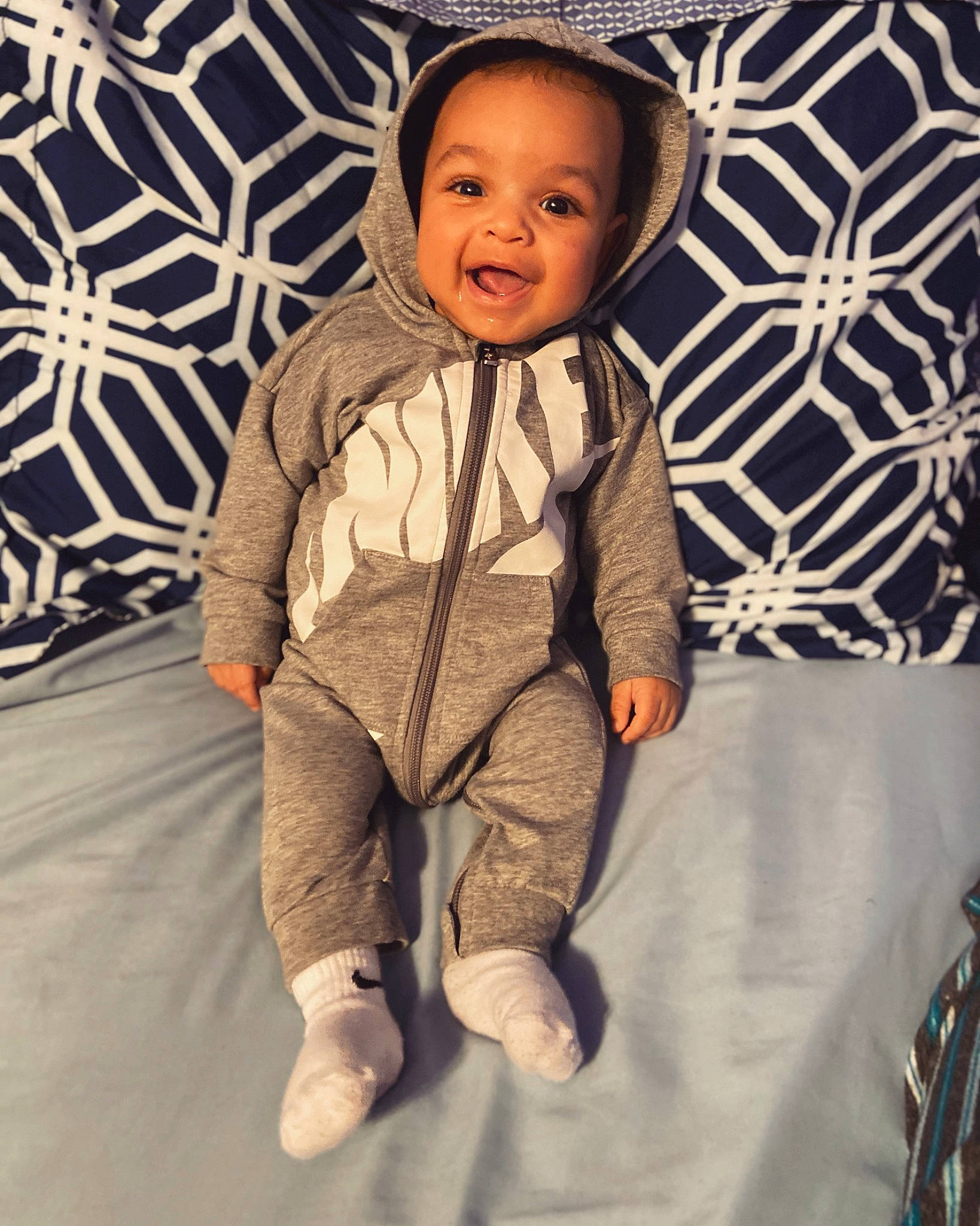 Ermias is registered to the contest to win money with this photo: baby, baby_products, baby_toddler_clothing, cheek, child, comfort, foot, nightwear, nose, pattern, person, sleeve, sock, toddler, tongue