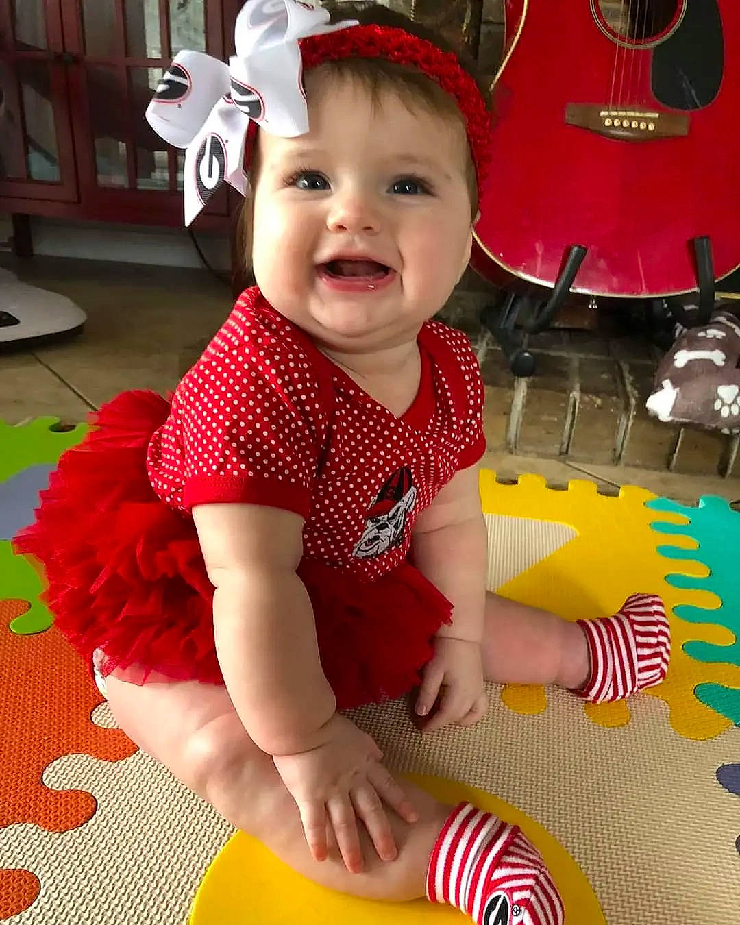 Stevie Lee is registered to the contest to win money with this photo: baby, baby_toddler_clothing, beauty, child, fun, happy, headwear, orange, pattern, person, pink, red, shorts, skin, sleeve, smile, snapshot, sock, t_shirt, thigh