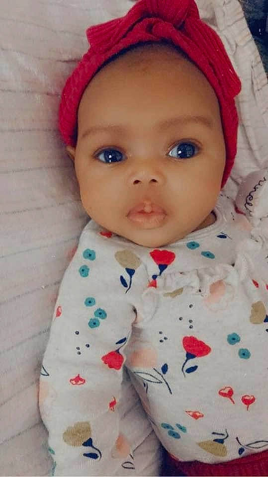 Khalani is registered to the contest to win money with this photo: baby, cheek, child, eye, face, forehead, hair_accessory, head, headgear, lip, nose, person, skin, smile, toddler