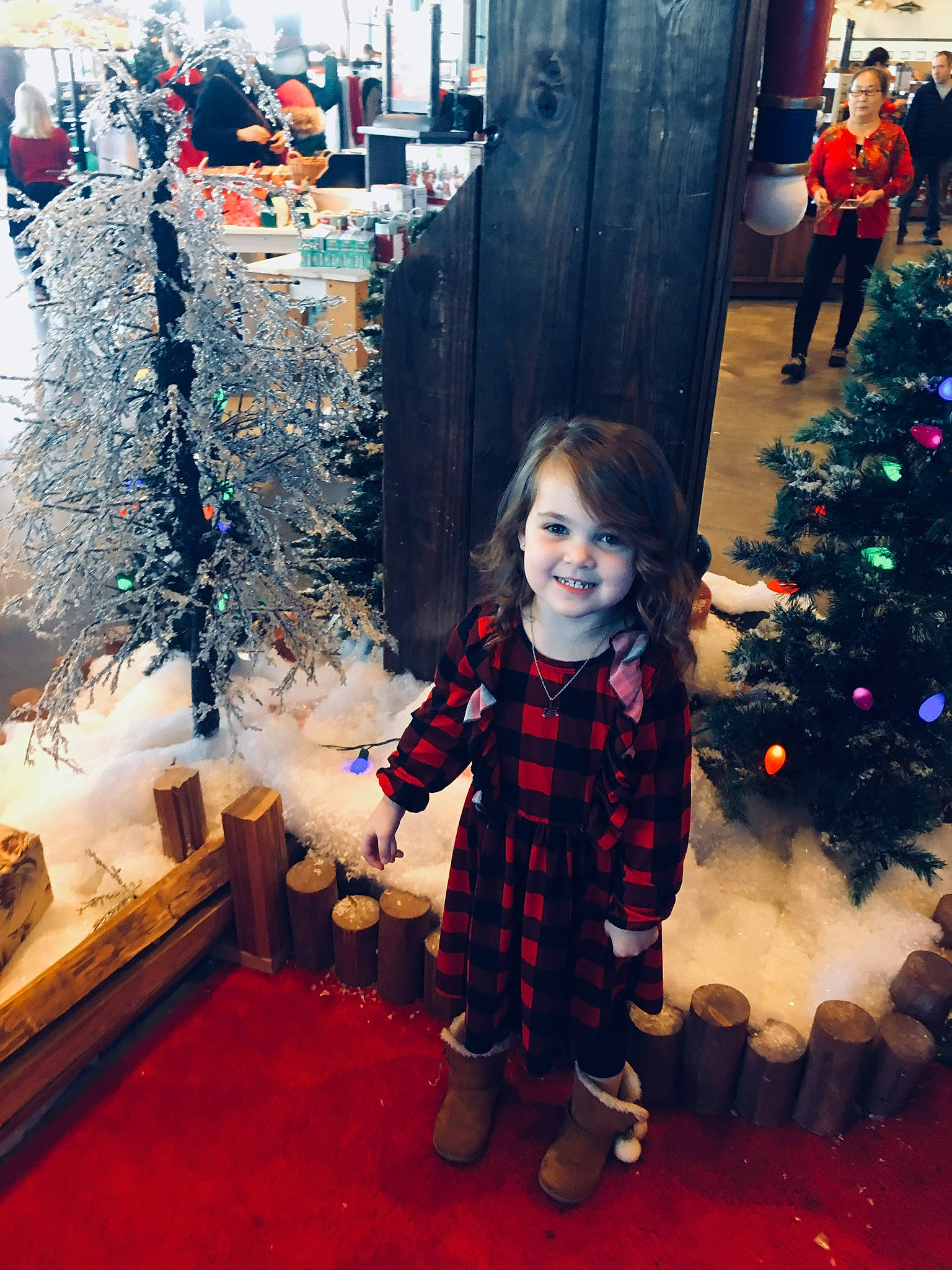 Jaycee is registered to the contest to win money with this photo: child, christmas, christmas_decoration, christmas_eve, christmas_ornament, christmas_tree, event, fir, happy, head, holiday, interior_design, joy, person, plant, sky, smile, snapshot, standing, toddler