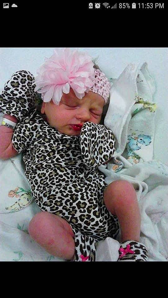 Nevaeh joined the competition — help win amazing prizes! art, baby, baby_sleeping, baby_toddler_clothing, cap, comfort, craft, fashion_accessory, font, hair_accessory, happy, headwear, knit_cap, linens, nail, pattern, person, petal, pink, thumb