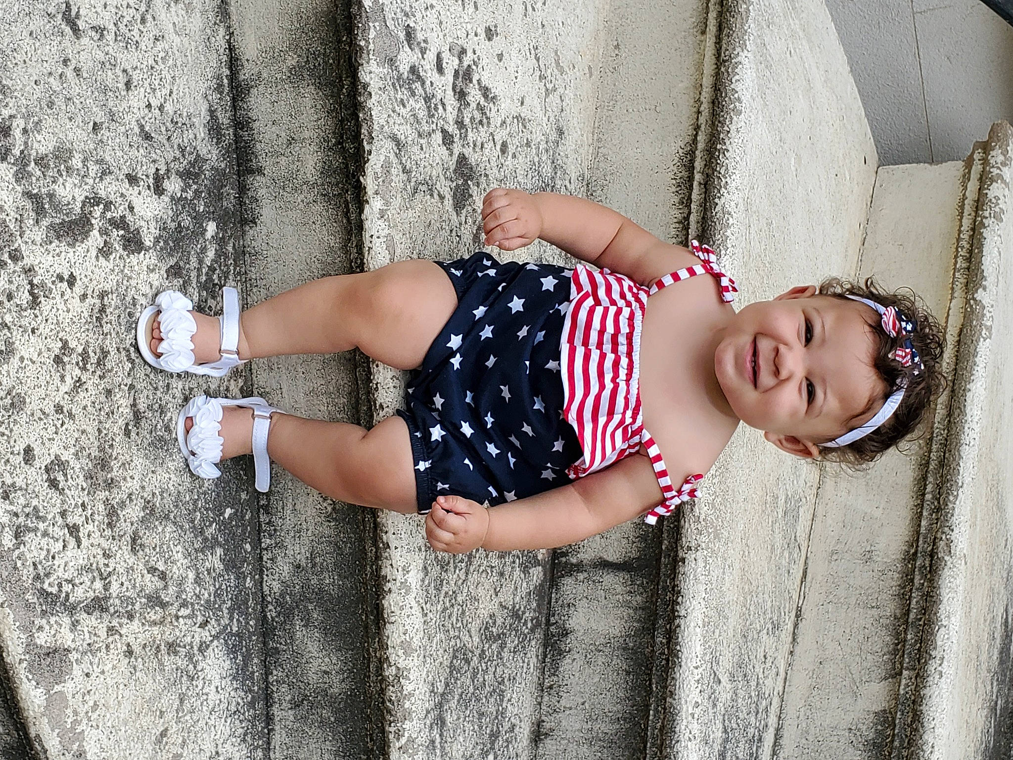 Fallon is registered to the contest to win money with this photo: arm, dress, elbow, eyewear, finger, hand, happy, human_body, human_leg, joint, joy, knee, leg, person, shoulder, smile, standing, textile, thigh, tree