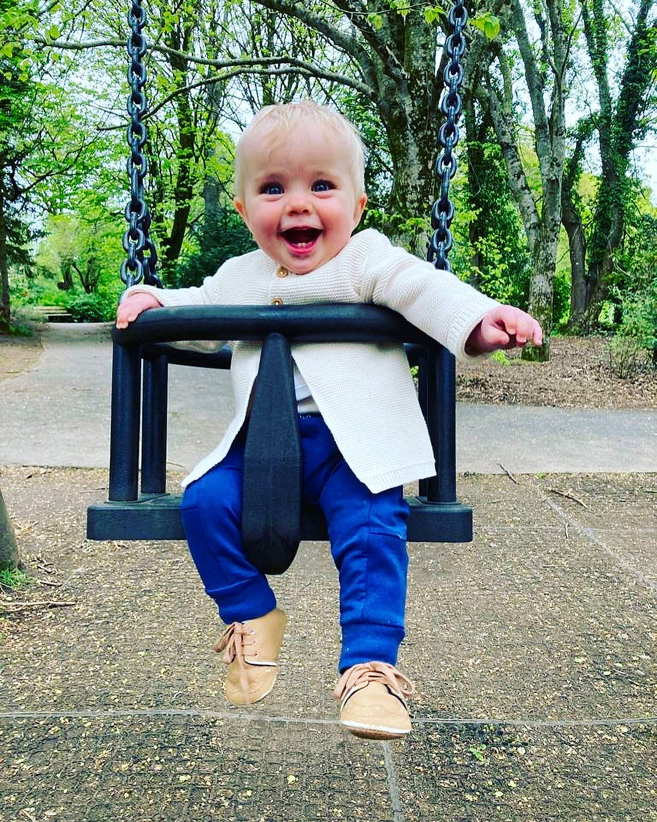Fraser joined the competition — help win amazing prizes! baby_toddler_clothing, child, denim, electric_blue, eye, finger, fun, grass, happy, leisure, outdoor_play_equipment, people_in_nature, person, plant, recreation, sitting, sleeve, smile, swing, toddler