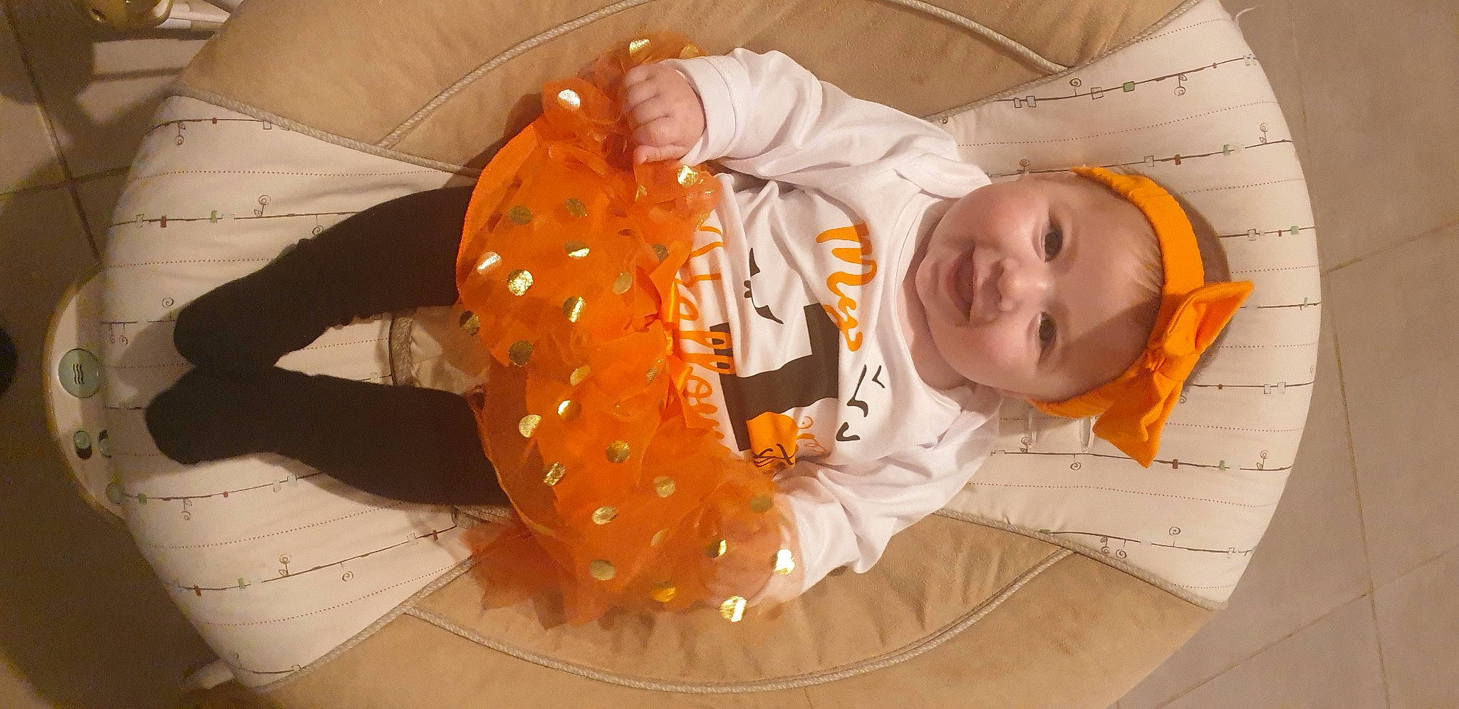 Shanna participe au concours pour gagner de l'argent avec cette photo : baby, baby_products, baby_toddler_clothing, child, circle, comfort, fun, headwear, mouth, orange, pattern, person, room, sitting, toddler