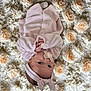 Ambre participe au concours pour gagner de l'argent avec cette photo : baby, pacifier, headband, pink_clothing, flower_background, infant, lying_down, soft_texture, peaceful, portrait, cute, newborn, baby_girl, floral, closeup, skin, hands, eyes, sleepwear, adorable