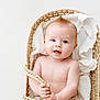 baby, basket, bed, blanket, bonnet, clothing, crib, face, furniture, happy, hat, head, infantbed, newborn, person, photography, portrait, sitting, smile, towel