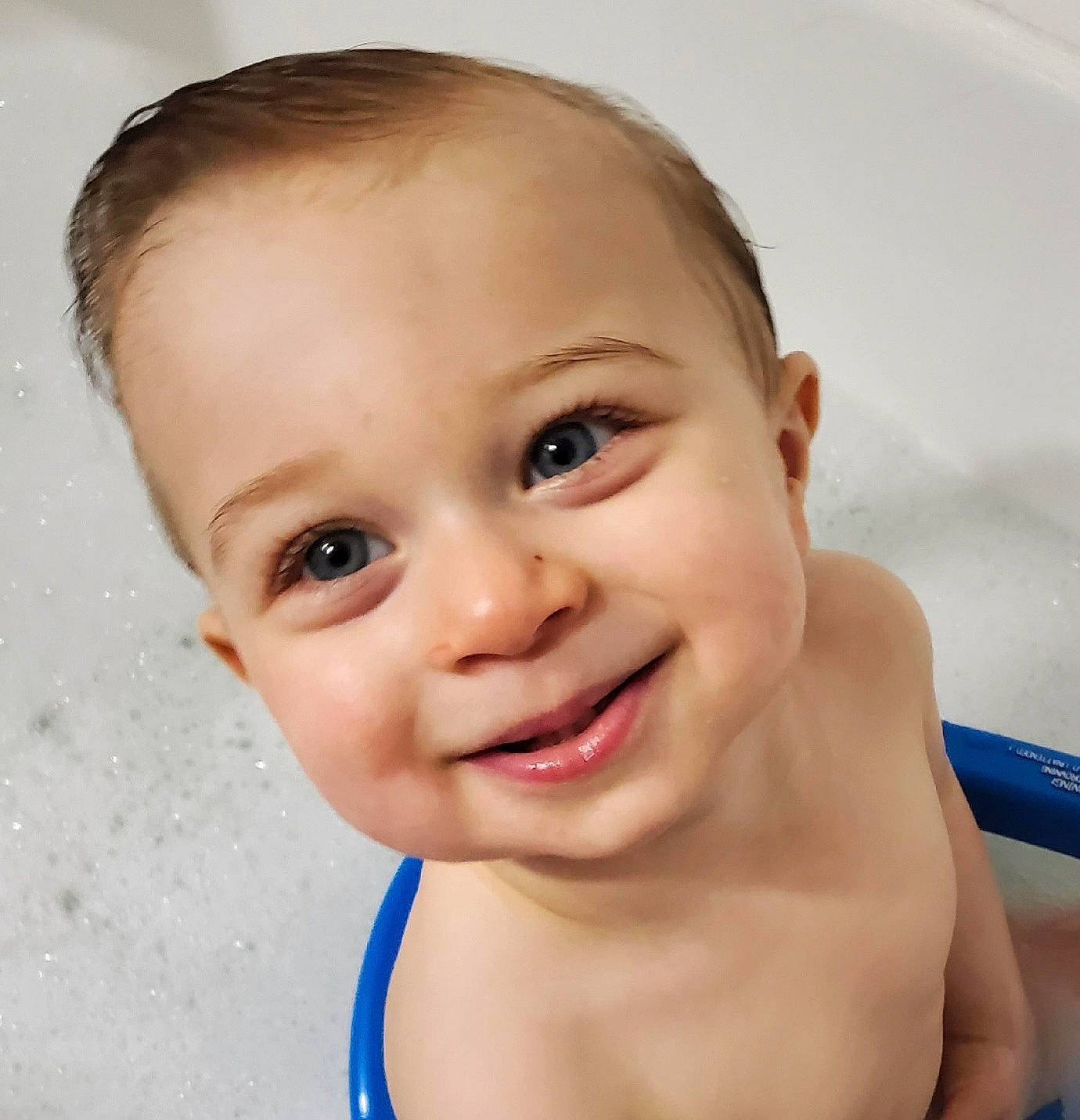 Cooper is registered to the contest to win money with this photo: bathing, cheek, chin, ear, eye, eyebrow, eyelash, flash_photography, gesture, happy, head, human_body, iris, jaw, joy, lip, neck, nose, person, skin