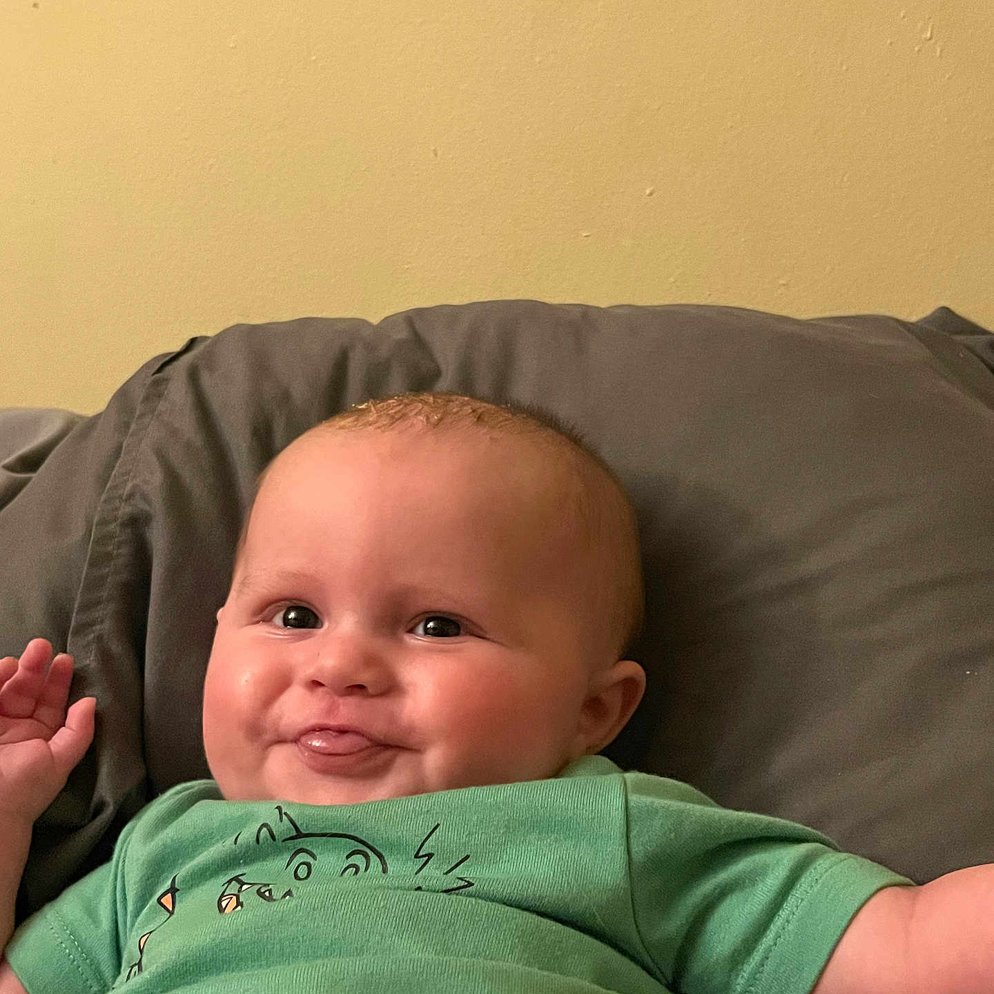 Castiel is registered to the contest to win money with this photo: baby, babylaughing, bodypart, clothing, couch, cushion, face, finger, furniture, hand, happy, head, homedecor, indoors, newborn, person, photography, portrait, smile, t_shirt