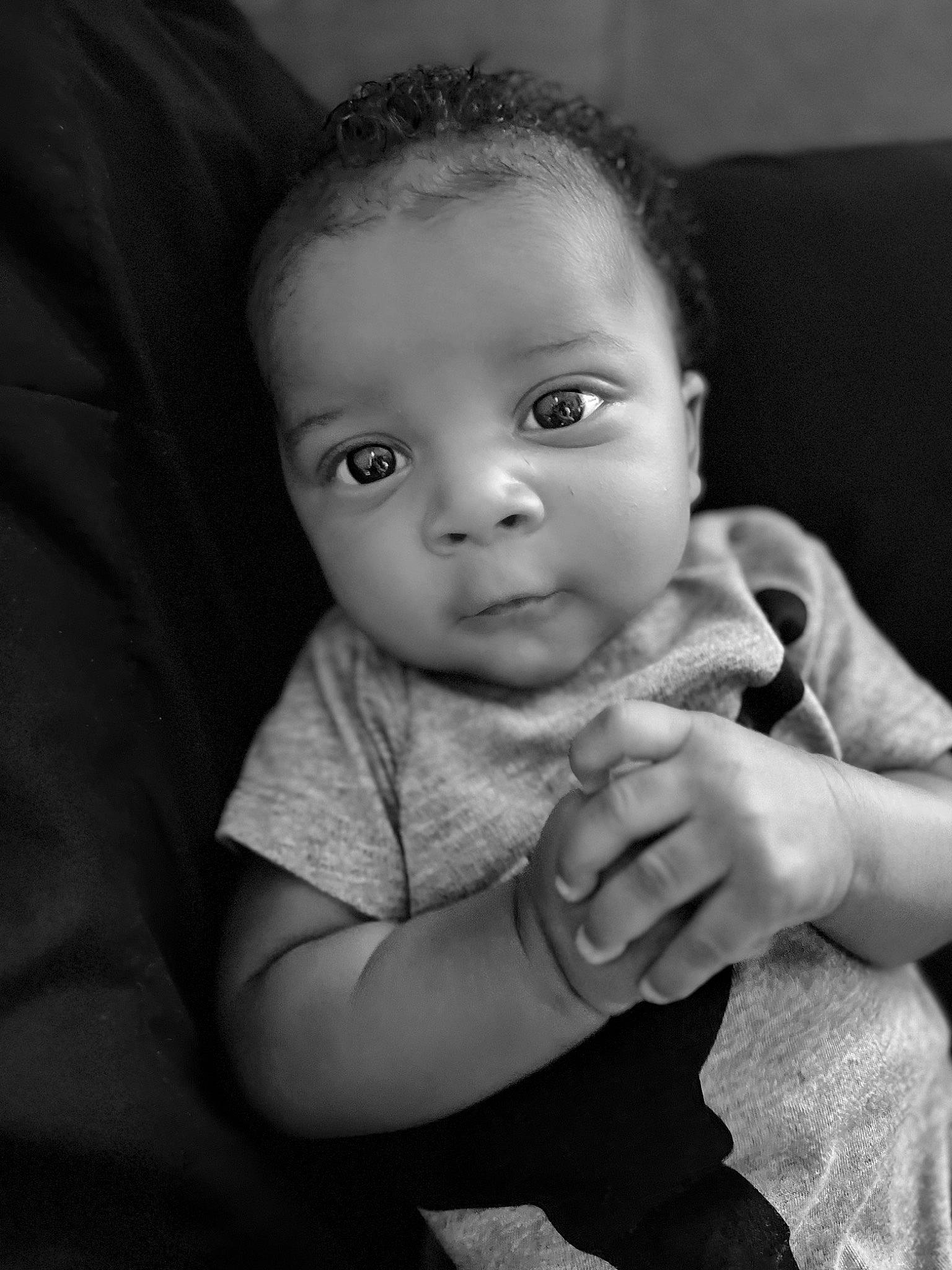 Kamarion joined the competition — help win amazing prizes! baby, baby_toddler_clothing, black_and_white, cheek, child, comfort, flash_photography, fun, gesture, hand, happy, iris, lip, monochrome, monochrome_photography, nose, person, skin, sleeve, smile