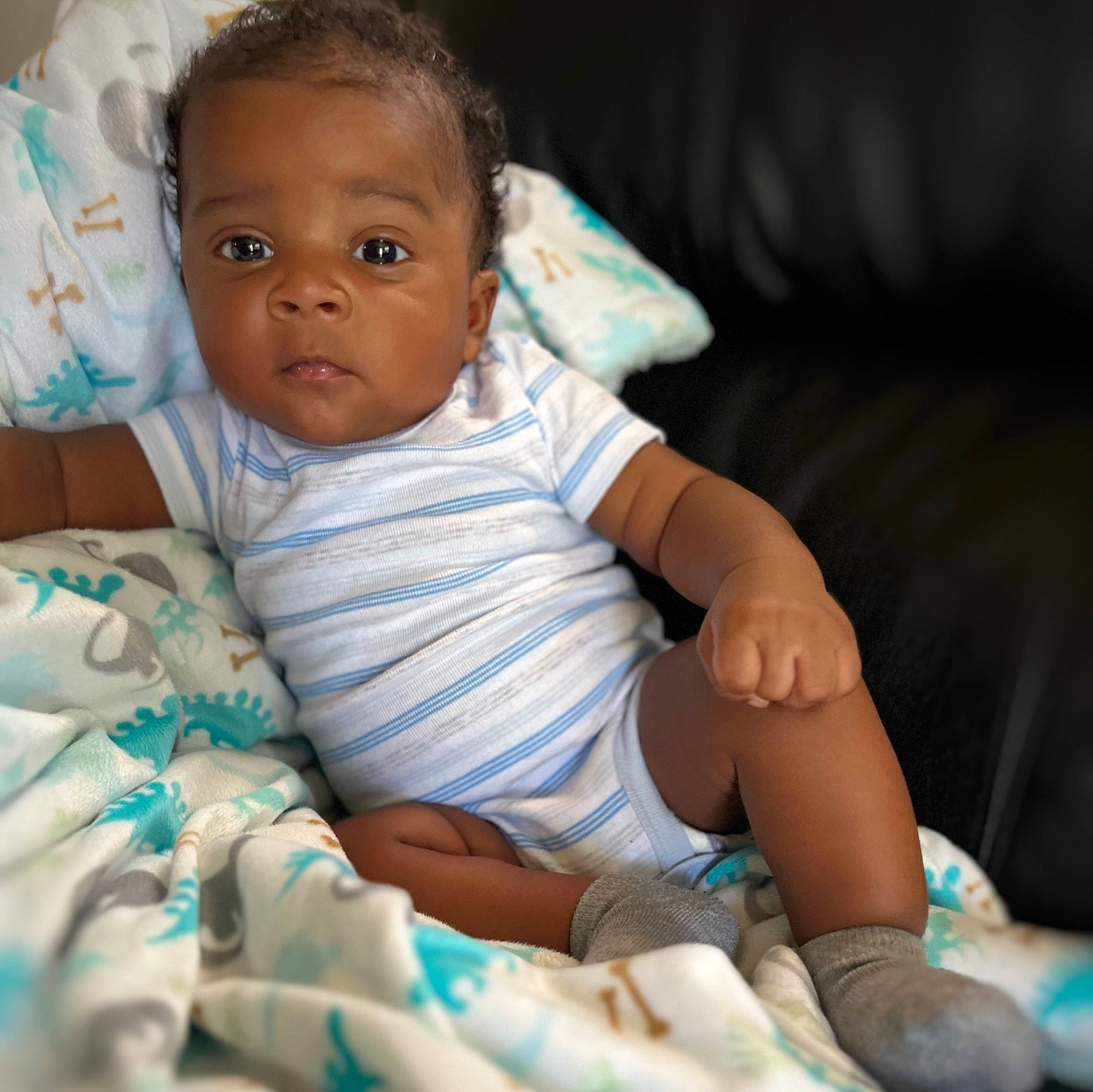 Kamarion joined the competition — help win amazing prizes! arm, baby, baby_toddler_clothing, cheek, child, comfort, finger, flash_photography, foot, fun, hand, happy, human_leg, knee, linens, person, sitting, skin, sleeve, sock