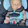 baby, car_seat, sleeping, infant, harness, clothing, sock, pink, white, polka_dot, seatbelt, child, cute, peaceful, close_up, napping, resting, indoor, person, toddler