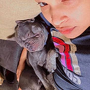 Blue joined the competition — help win amazing prizes! person, dog, puppy, sleeping, cuddling, sofa, pillow, selfie, face, paw, fur, pet, nap, cozy, indoor, tshirt, close_up, relaxing, cute, companion