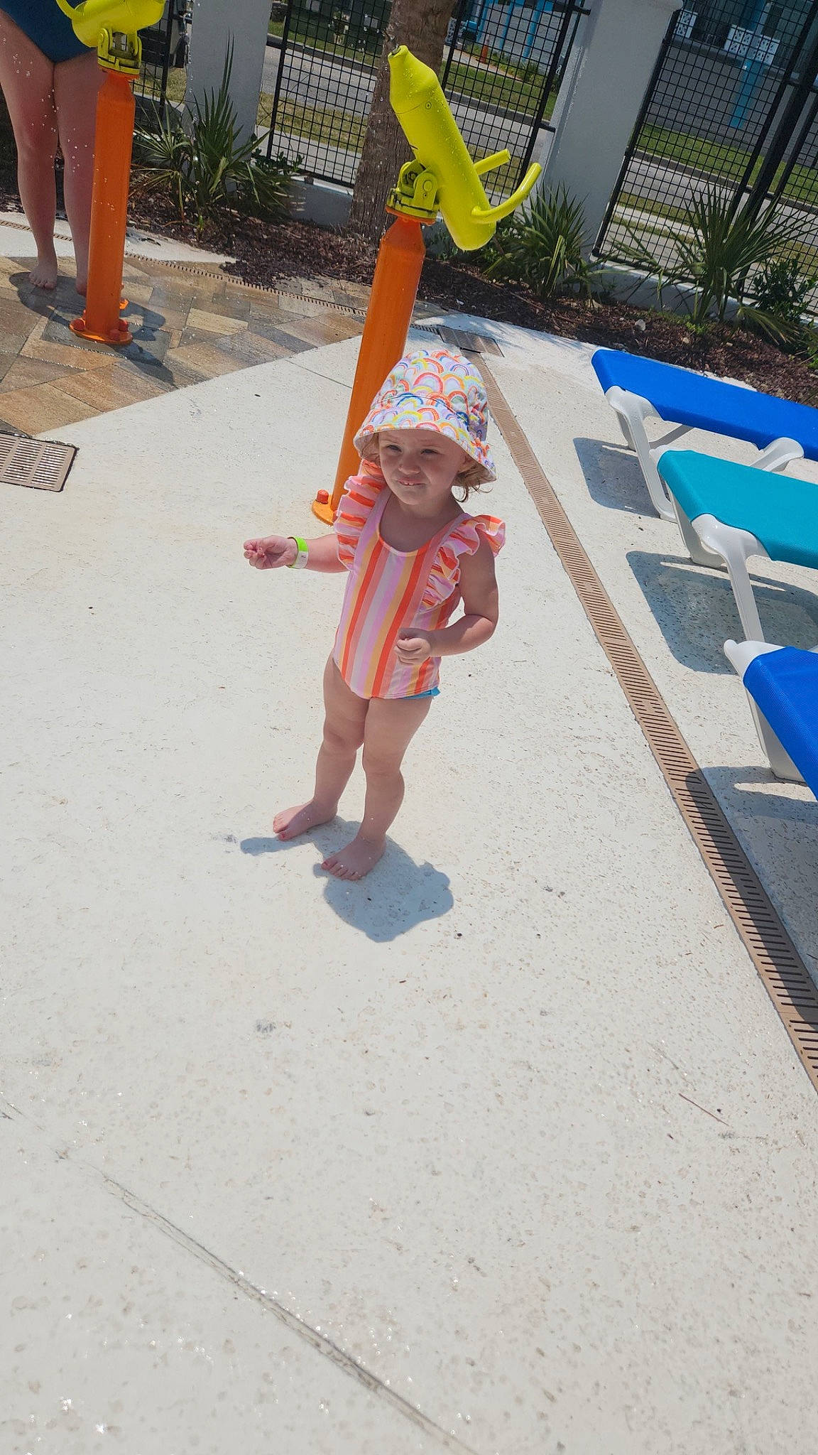 Waverley is registered to the contest to win money with this photo: asphalt, baby, barefoot, child, city, concrete, flooring, foot, fun, grass, hat, headwear, human_leg, joy, leisure, person, recreation, shade, shorts, summer