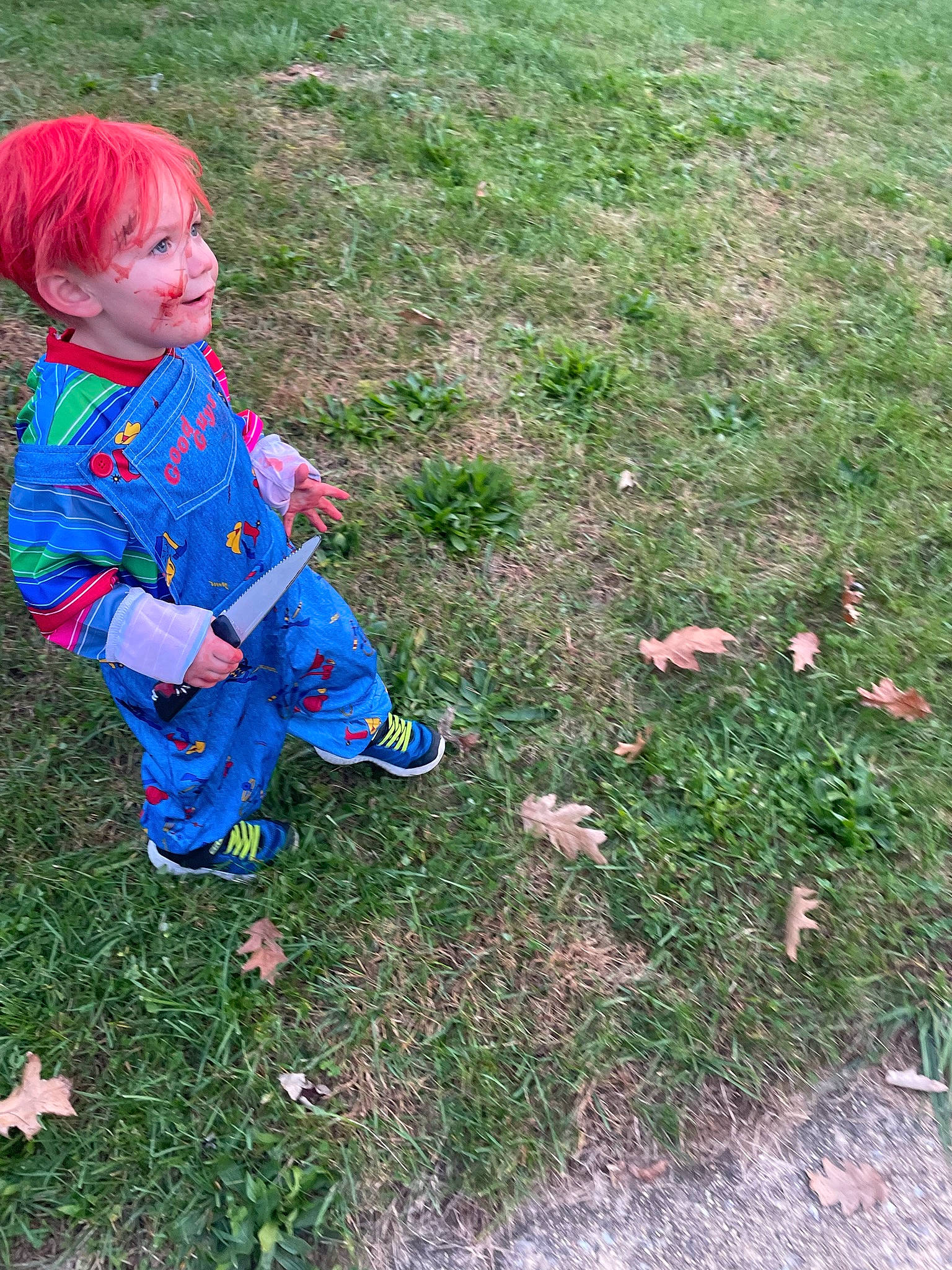 Wyatt is registered to the contest to win money with this photo: baby_toddler_clothing, boot, child, electric_blue, fun, garden, grass, grass_family, grassland, groundcover, lawn, people_in_nature, person, plant, play, recreation, sitting, smile, soil, toddler
