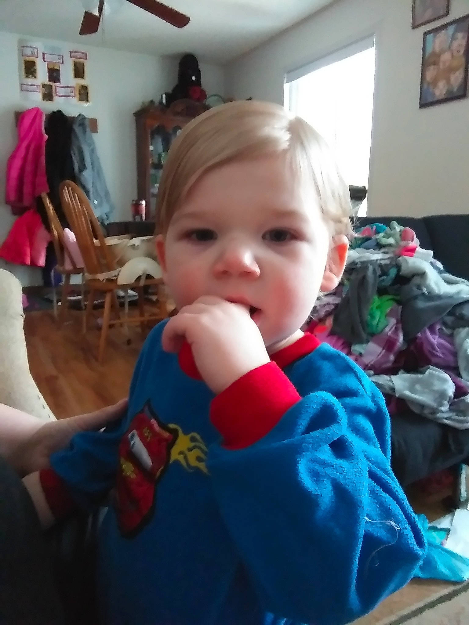 Daemon is registered to the contest to win money with this photo: arm, baby, cheek, child, face, fictional_character, finger, fun, head, mouth, person, play, smile, thumb, toddler