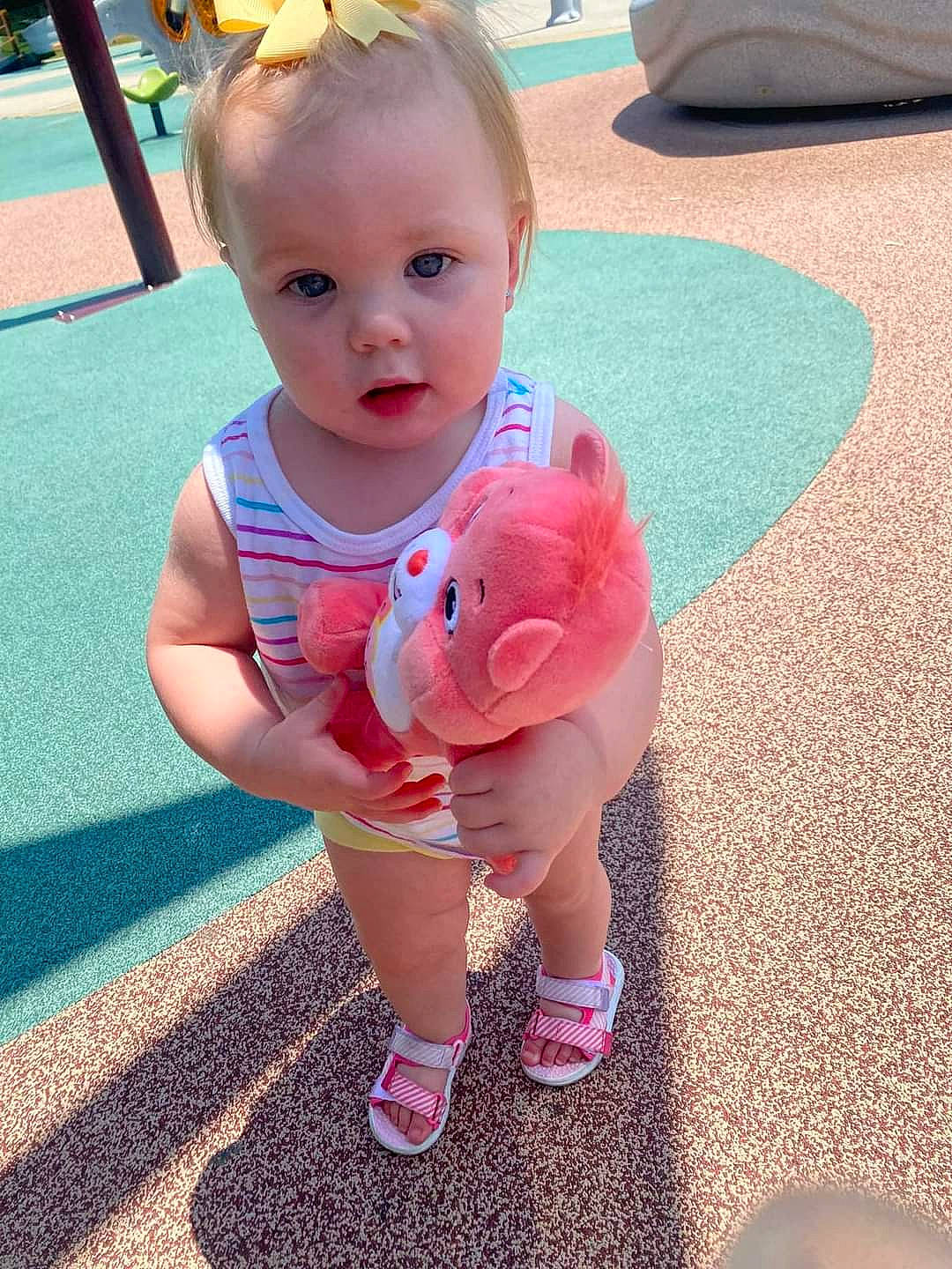 Lillith is registered to the contest to win money with this photo: baby, baby_toddler_clothing, beauty, child, face, flooring, fun, grass, hairstyle, happy, head, joint, leisure, person, pink, shorts, skin, smile, summer, t_shirt