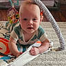 baby, child, play_mat, toy, floor, carpet, infant, tummy_time, colorful, curious, indoors, cute, person, childhood, crawling, soft, playtime, clothing, smiling, young