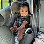 Zaylee is registered to the contest to win money with this photo: toddler, car_seat, child, smiling, seatbelt, vehicle_interior, window, clothing, shoe, blanket, toy, happy, face, hair, seat, child_safety, car, interior, person, sitting