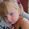 child, girl, toddler, portrait, close_up, blue_eyes, blonde_hair, hair_bow, pouting, face, indoors, car, car_seat, adult, cuddling, shoulder, dress, hand, photography, family