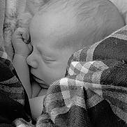 Gremmery is registered to the contest to win money with this photo: newborn, baby, sleeping, infant, portrait, black_and_white, close_up, peaceful, cozy, blanket, plaid, fist, face, hair, eyes_closed, resting, indoors, soft_lighting, candid, nap