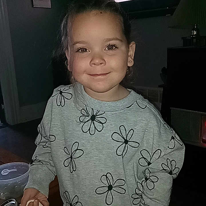 Stella is registered to the contest to win money with this photo: architecture, building, child, clothing, computerhardware, cup, electronics, face, female, furniture, girl, hardware, head, monitor, person, photography, portrait, screen, t_shirt, tv