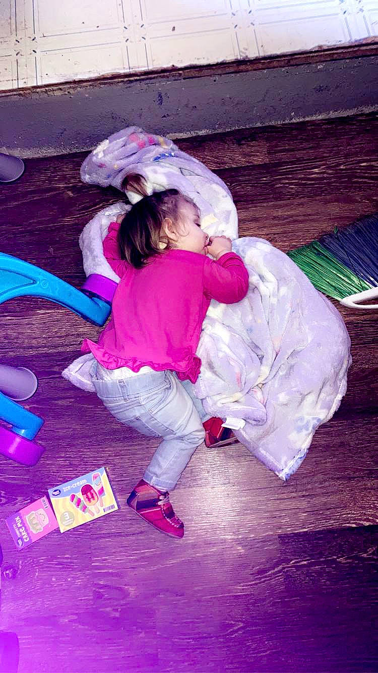 Abigail is registered to the contest to win money with this photo: baby, baby_toddler_clothing, child, flooring, fun, grass, happy, leisure, magenta, person, pink, play, purple, recreation, room, sandal, sitting, tints_and_shades, toddler, tree