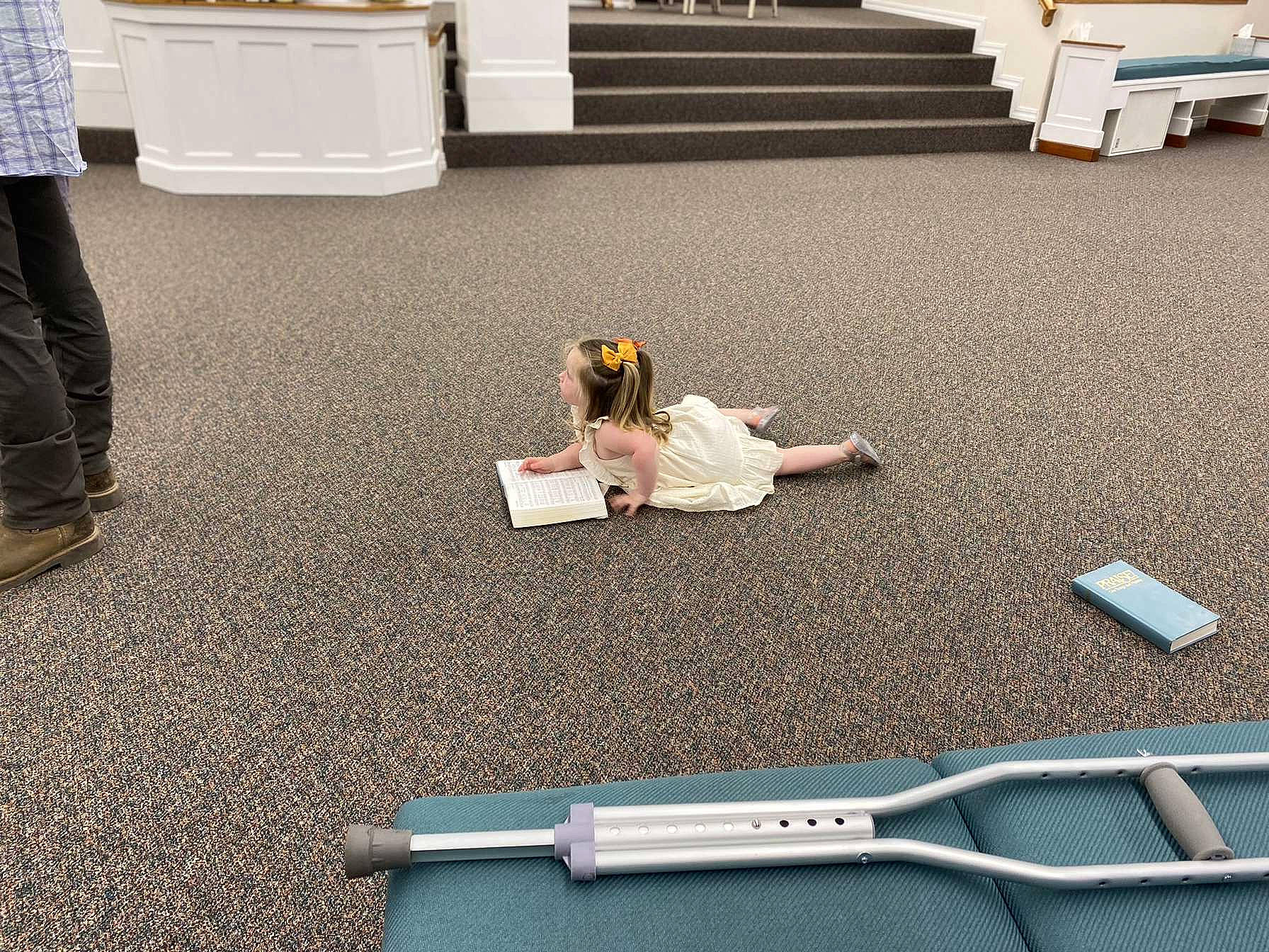 Abby is registered to the contest to win money with this photo: animation, asphalt, floor, flooring, fun, games, grass, leisure, line, pc_game, person, recreation, road, road_surface, room, sidewalk, sitting, white, wood