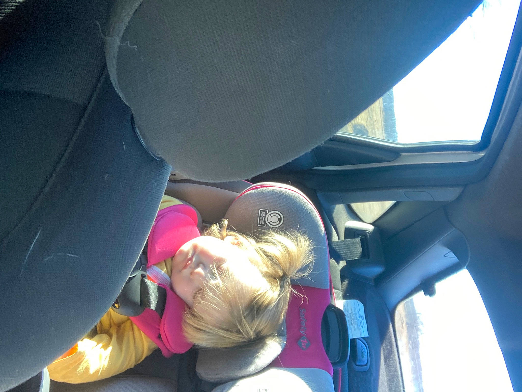 Abigail is registered to the contest to win money with this photo: auto_part, automotive_design, automotive_exterior, automotive_window_part, car, car_seat, car_seat_cover, family_car, fun, hat, head_restraint, leisure, motor_vehicle, passenger, person, steering_wheel, toddler, vehicle, vehicle_door, window