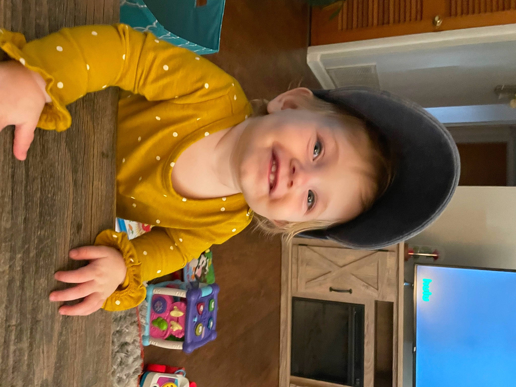 Abigail is registered to the contest to win money with this photo: baby, baby_toddler_clothing, child, display_device, finger, flat_panel_display, fun, gadget, happy, joy, leisure, person, play, room, smile, television, television_set, thumb, toddler, vacation